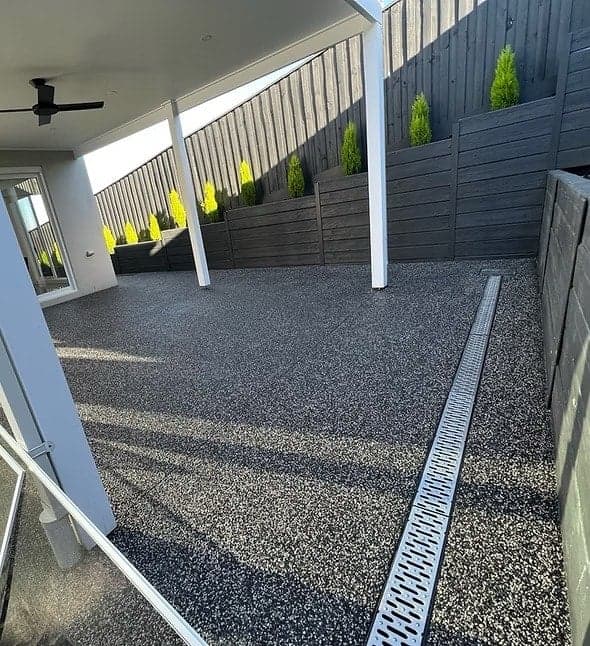 Finished dark exposed aggregate alfresco area