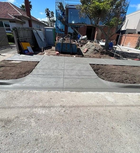 Concrete vehicle crossover from road to driveway